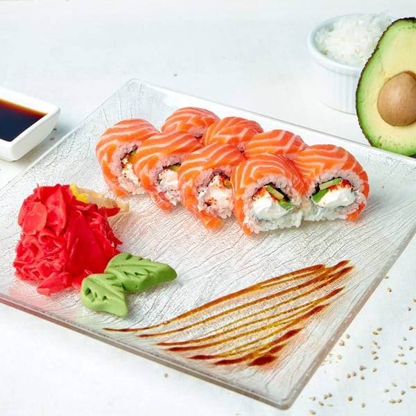 Min Sushi's salmon and cream cheese rolls with avocado, served with ginger, wasabi, and soy sauce.